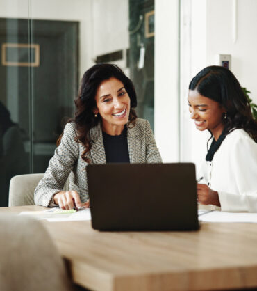 woman smilling at the laptop