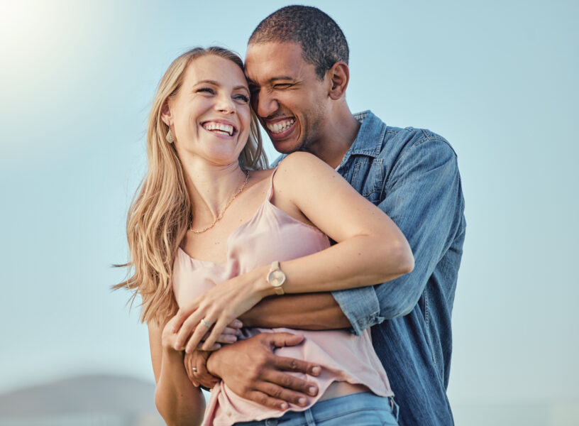 Love, diversity and couple hug on vacation, holiday or summer trip. Romantic, relax smile and happy man and woman hugging, embrace or cuddle, having fun and enjoying quality time together outdoors Love, diversity and couple hug on vacation, holiday or summer trip. Romantic, relax smile and happy man and woman hugging, embrace or cuddle, having fun and enjoying quality time together outdoors