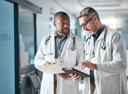 Hospital, teamwork and doctors with folder, tablet and brainstorming for healthcare and administration. Medical, leader and senior professional with tech and meeting with documents and share info