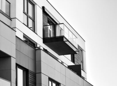 Contemporary residential building exterior in the daylight. Black and white.