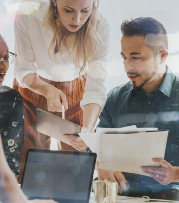 Business people working with a digital tablet in a meeting